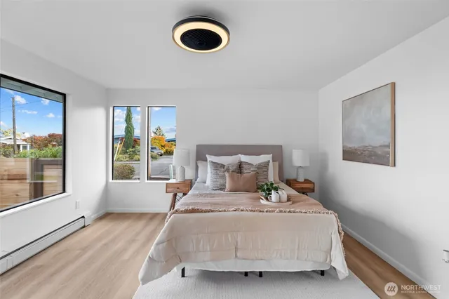 a bedroom with a bed and a couch