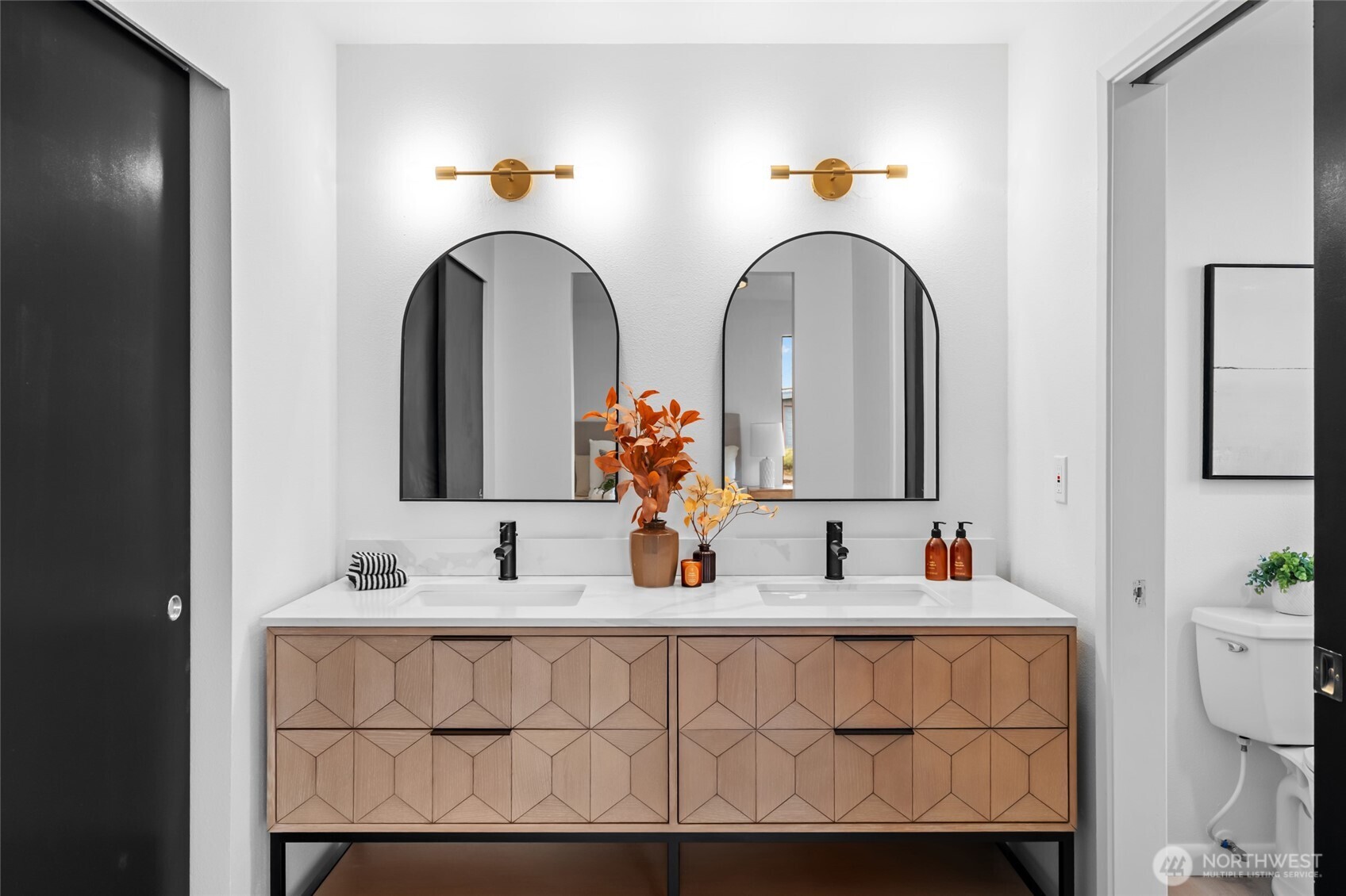 1414 Hummingbird Lane Northwest Olympia, WA 98502 - Photo 37 of 40 a bathroom with a sink and a mirror