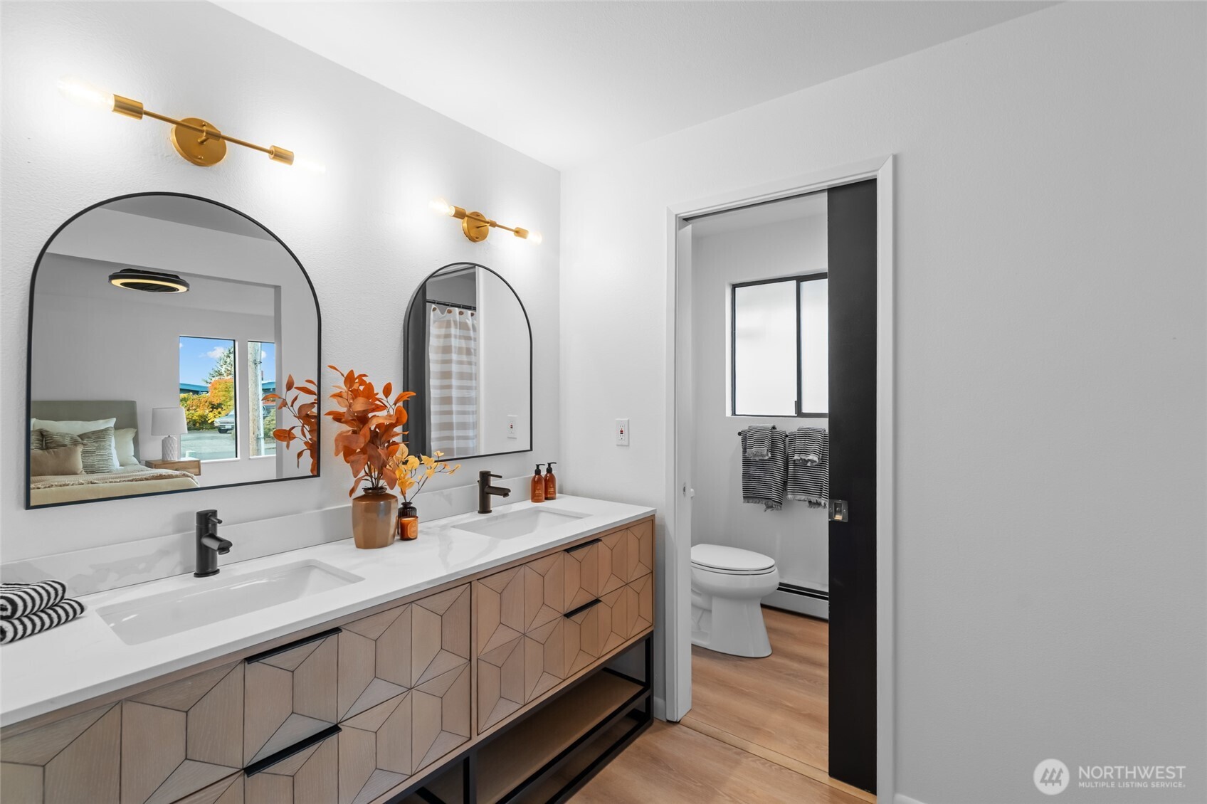 1414 Hummingbird Lane Northwest Olympia, WA 98502 - Photo 38 of 40 a spacious bathroom with a double vanity sink and a mirror