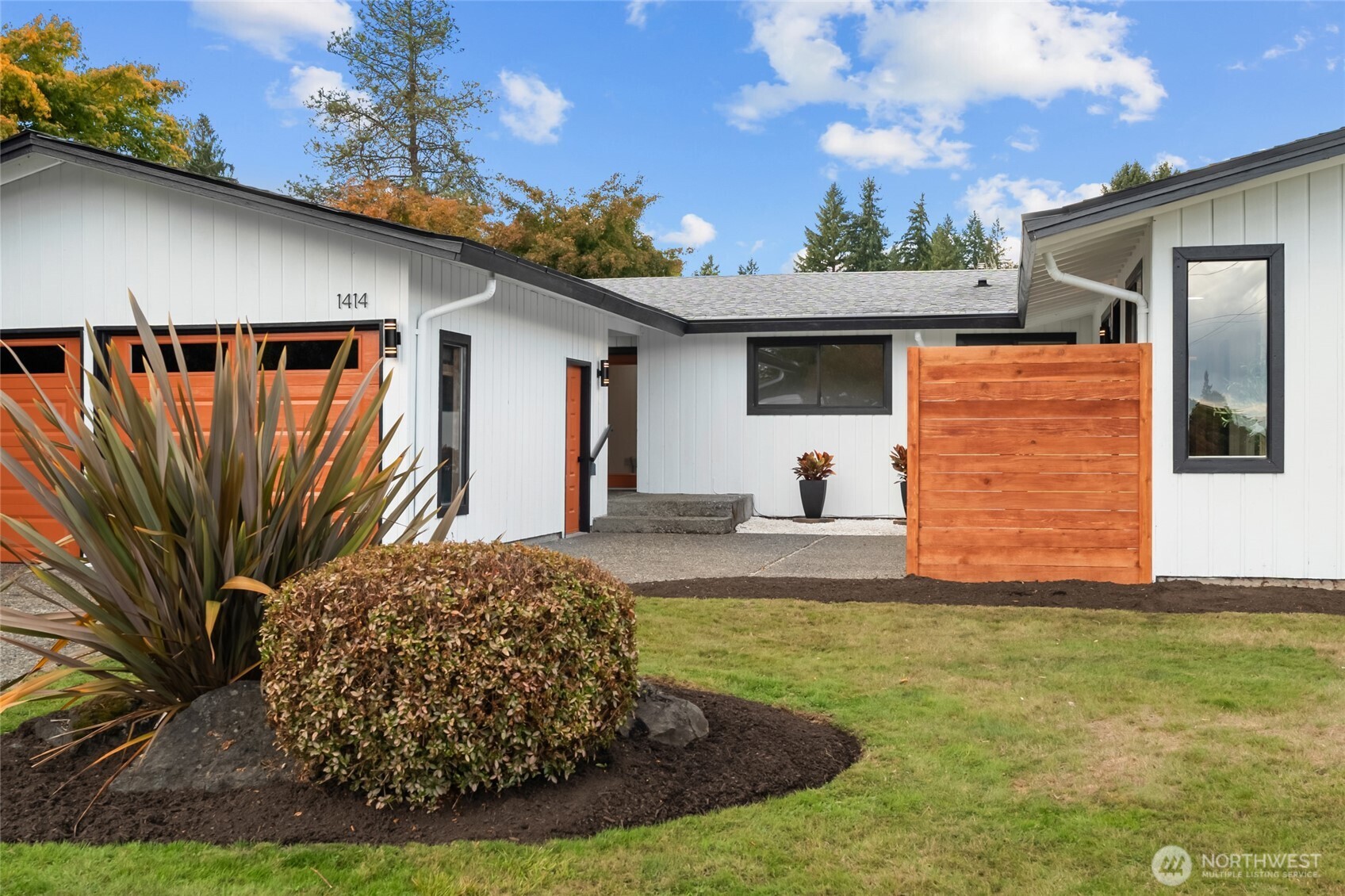 1414 Hummingbird Lane Northwest Olympia, WA 98502 - Photo 9 of 40 a view of a house with backyard and sitting area