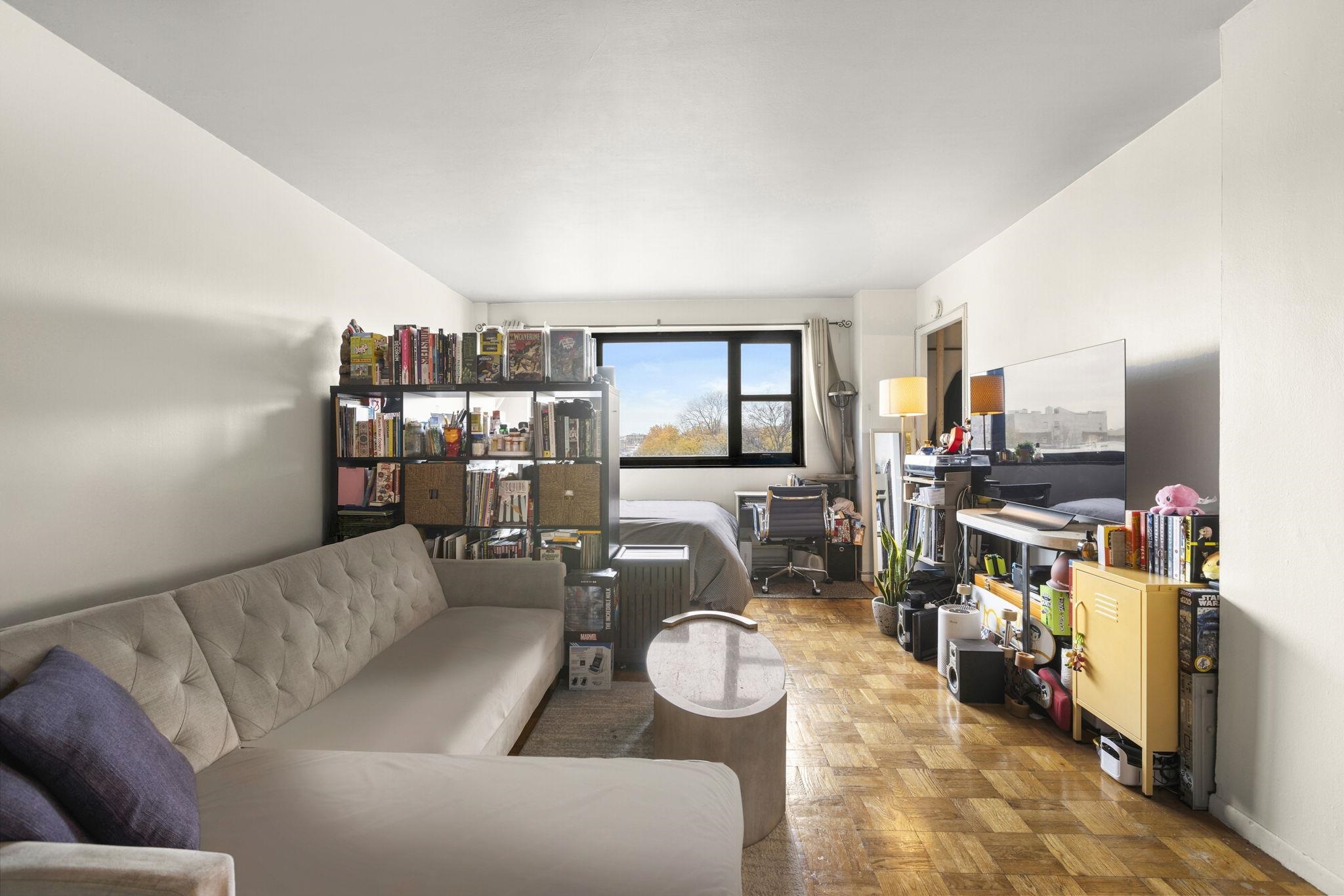6515 Boulevard East, Unit 6R West New York, NJ 07093 - Photo 1 of 13 a living room with furniture and a flat screen tv