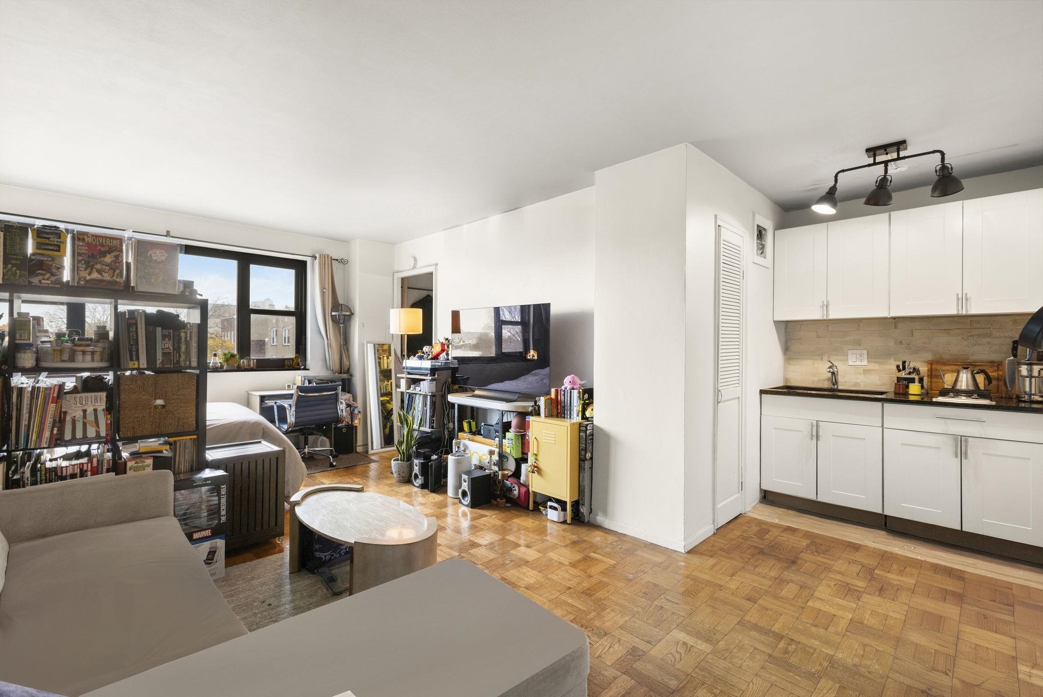 6515 Boulevard East, Unit 6R West New York, NJ 07093 - Photo 4 of 13 a living room with furniture and a window