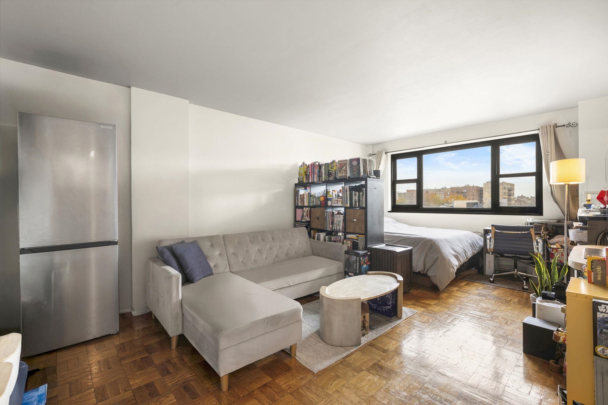 6515 Boulevard East, Unit 6R West New York, NJ 07093 - Photo 8 of 13 a living room with furniture and a large window