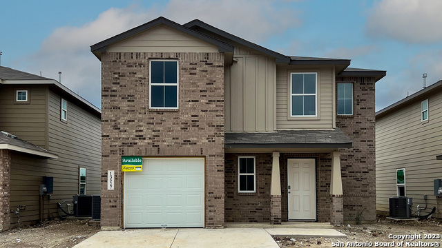a front view of a house with yard