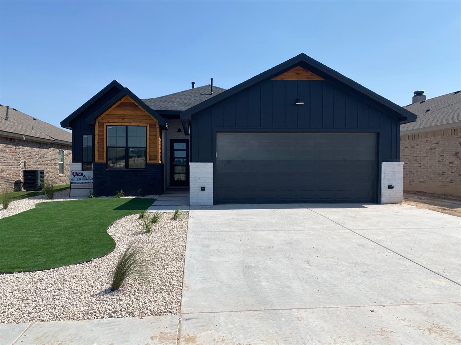 5845 Itasca Street Lubbock, TX 79416 - Photo 1 of 14 a front view of a house with a yard and garage