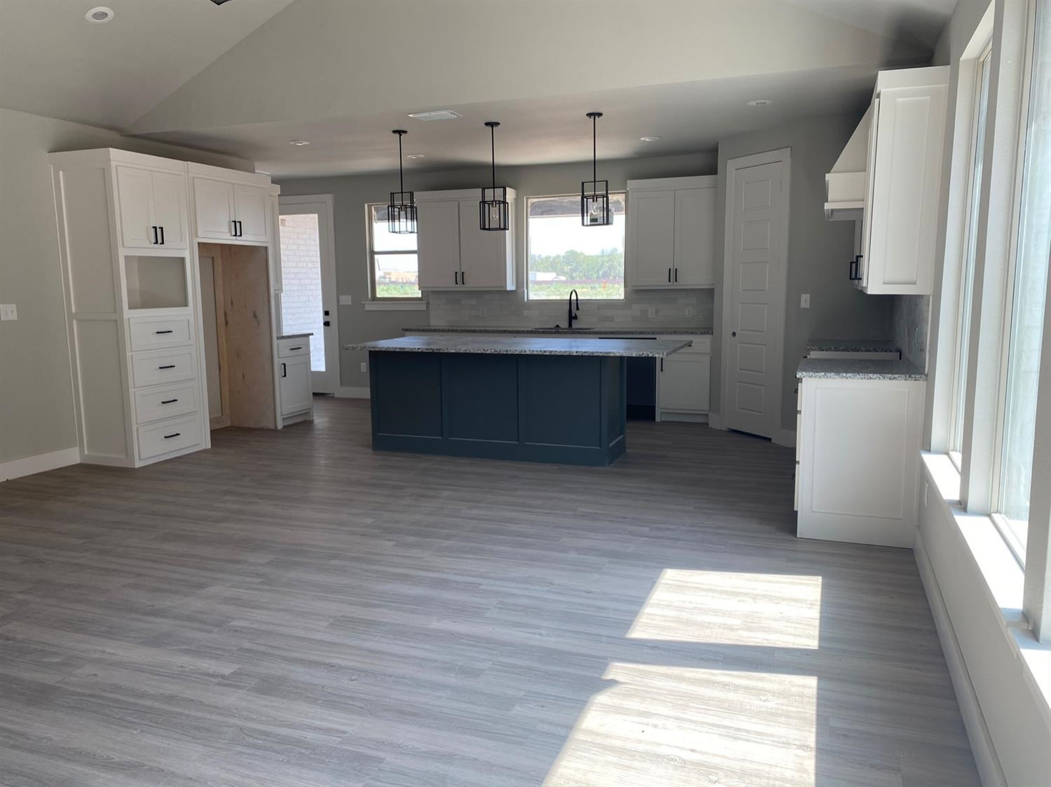 5845 Itasca Street Lubbock, TX 79416 - Photo 4 of 14 a kitchen with stainless steel appliances a refrigerator and a wooden floor