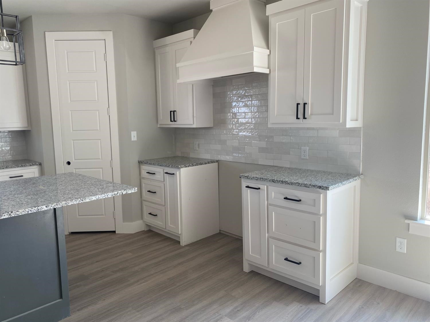 5845 Itasca Street Lubbock, TX 79416 - Photo 6 of 14 a kitchen with white cabinets and sink