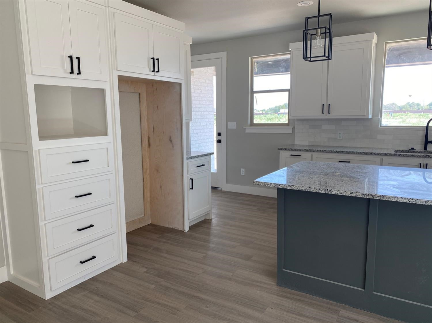 5845 Itasca Street Lubbock, TX 79416 - Photo 7 of 14 a kitchen with stainless steel appliances granite countertop a refrigerator and a sink