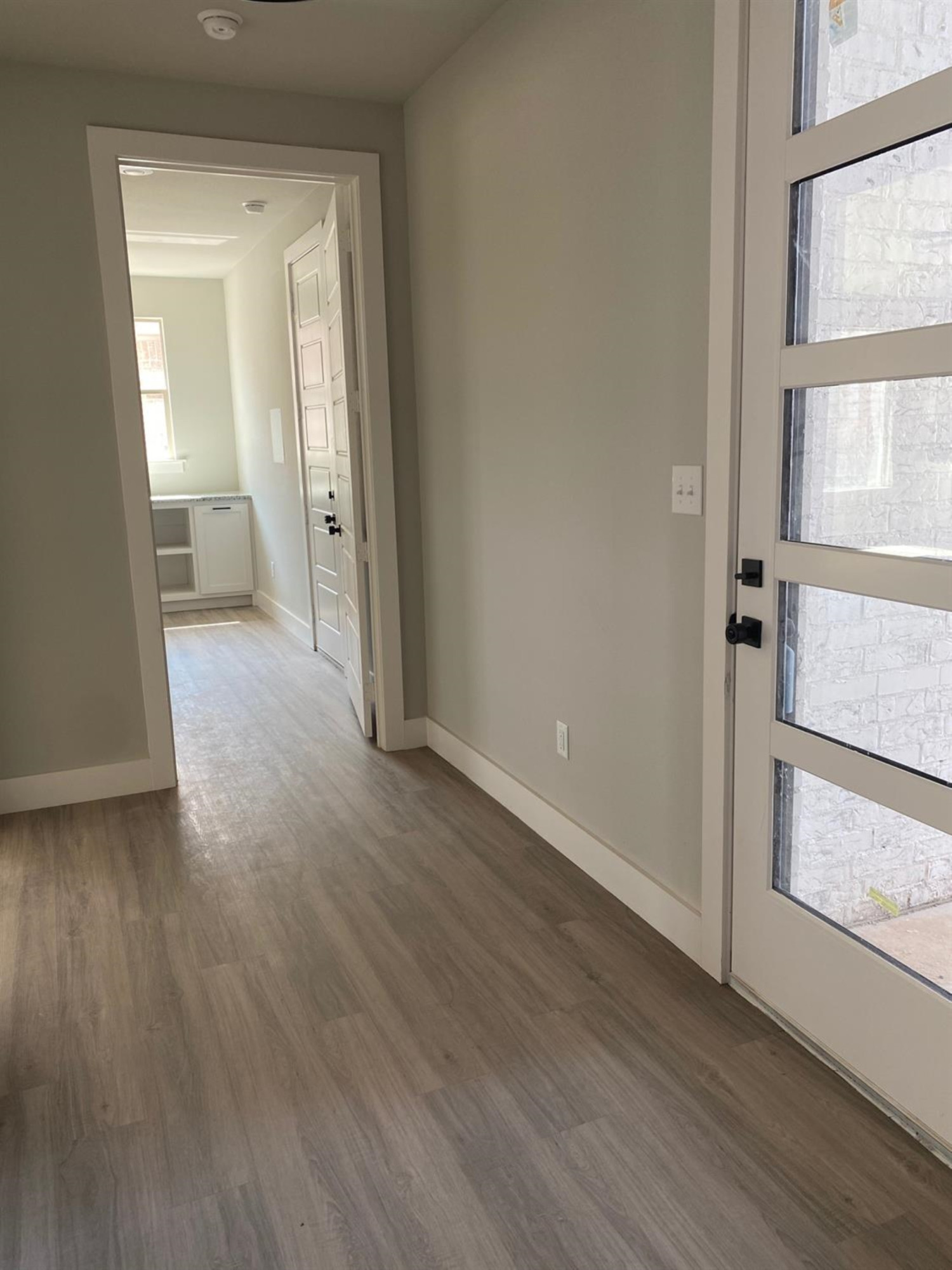 5845 Itasca Street Lubbock, TX 79416 - Photo 10 of 14 a view of a room with wooden floor and a bathroom