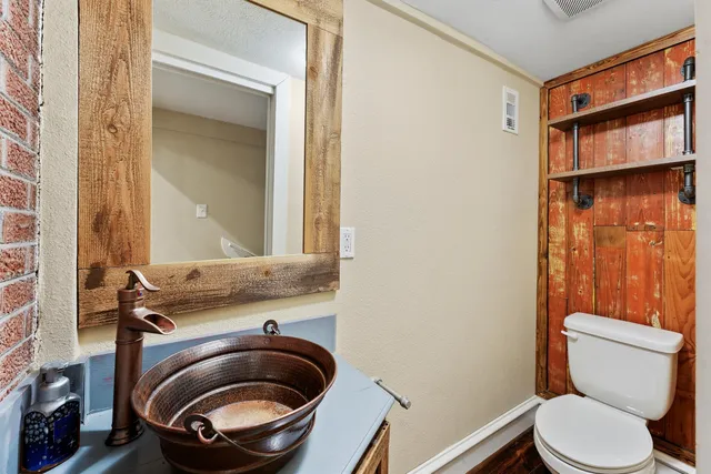 a bathroom with a toilet and a sink