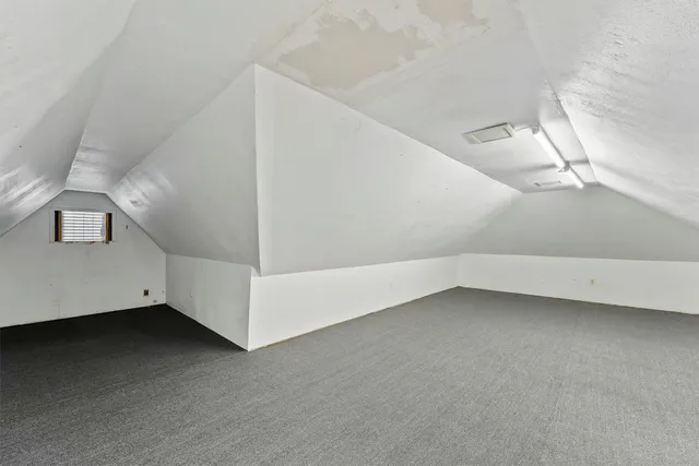 a view of a room with white walls