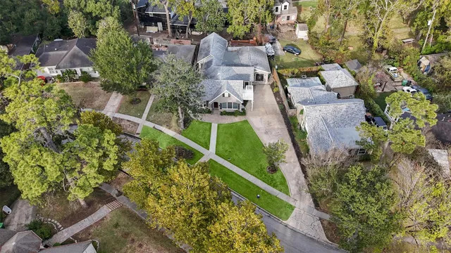 an aerial view of multiple houses with yard