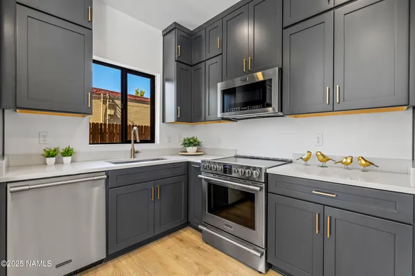 a kitchen with a stove and a sink