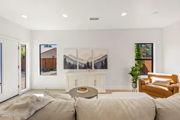 a living room with furniture and window