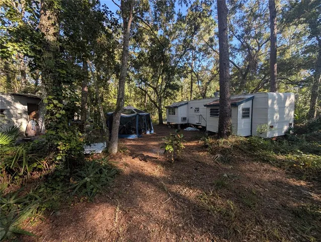 a view of a house with a tree