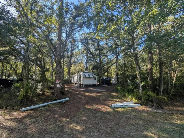 a view of a tree in front of a house