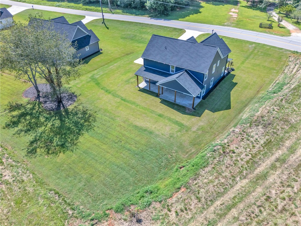 1723 Harris Bridge Road Anderson, SC 29621 - Photo 30 of 33 Aerial view showcasing a modern home with covered patios, nestled on a verdant lot.