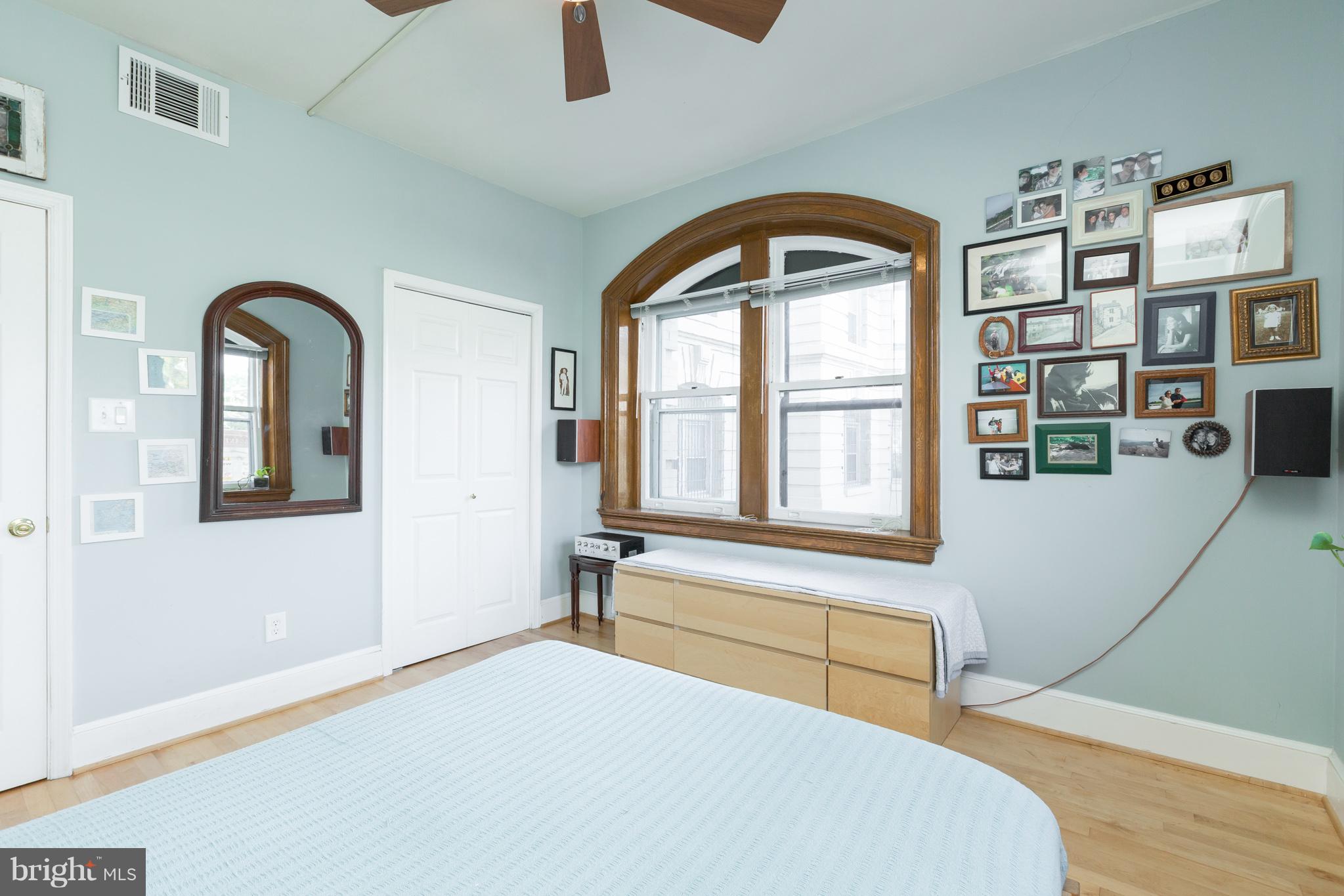 3060 16th Street Northwest, Unit 102 Washington, DC 20009 - Photo 11 of 17 a bedroom with a bed and a large window