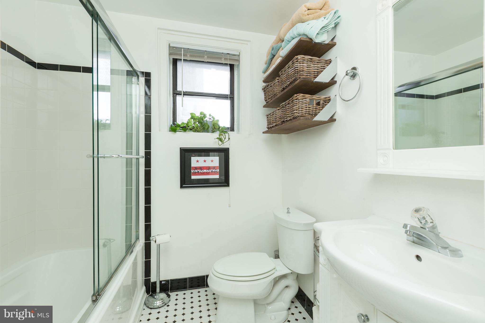 3060 16th Street Northwest, Unit 102 Washington, DC 20009 - Photo 8 of 17 a bathroom with a toilet and a sink