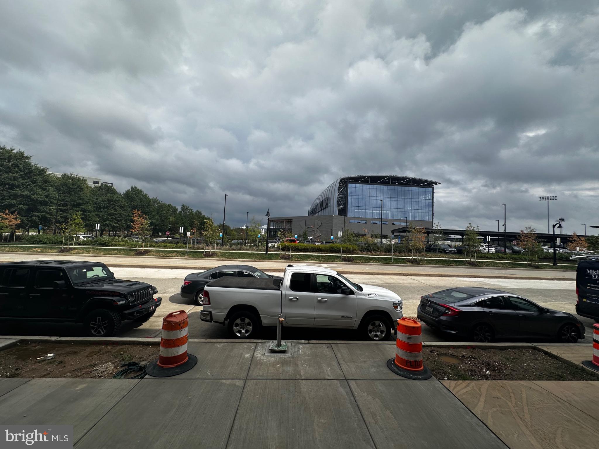 2504 West Peninsula Drive, Unit A Baltimore, MD 21207 - Photo 11 of 33 a view of a cars park fire pit and couches in a patio