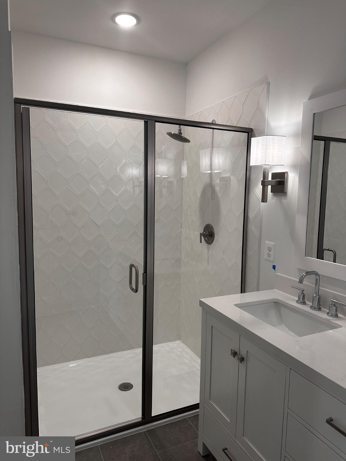 2504 West Peninsula Drive, Unit A Baltimore, MD 21207 - Photo 14 of 33 a bathroom with a shower and a sink