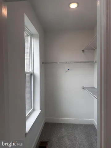 a bathroom with a double vanity sink and mirror