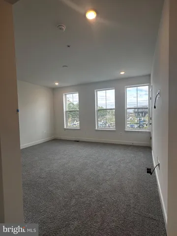 a bathroom with a granite countertop sink mirror and shower