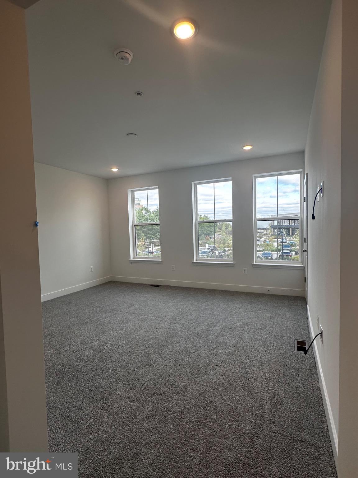 2504 West Peninsula Drive, Unit A Baltimore, MD 21207 - Photo 26 of 33 an empty room with windows