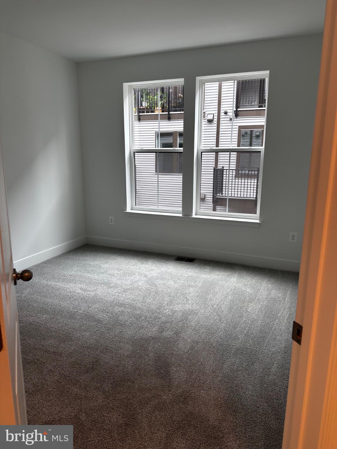 2504 West Peninsula Drive, Unit A Baltimore, MD 21207 - Photo 7 of 33 an empty room with windows