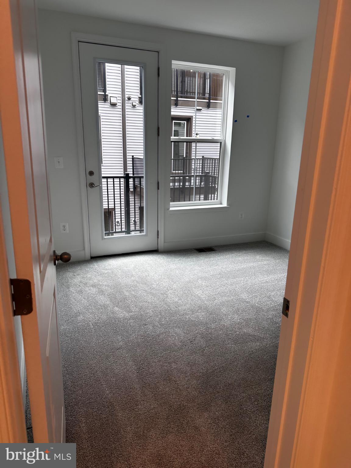 2504 West Peninsula Drive, Unit A Baltimore, MD 21207 - Photo 9 of 33 an empty room with windows