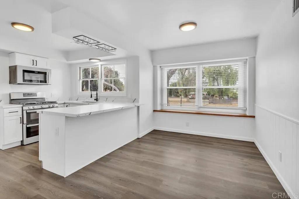 988 Pepper Drive El Cajon, CA 92021 - Photo 23 of 41 a kitchen with stainless steel appliances granite countertop a stove and a sink