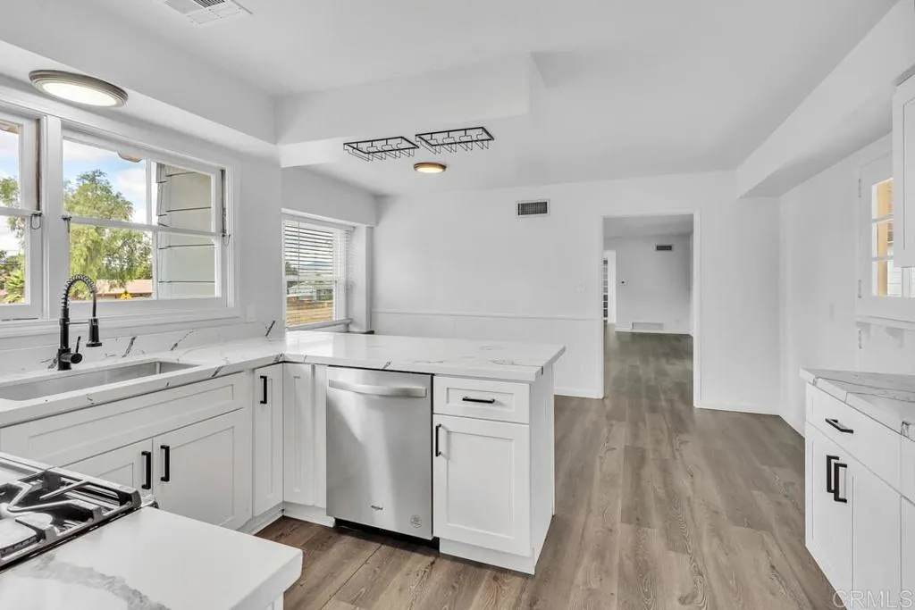 988 Pepper Drive El Cajon, CA 92021 - Photo 26 of 41 a kitchen with a sink appliances and cabinets