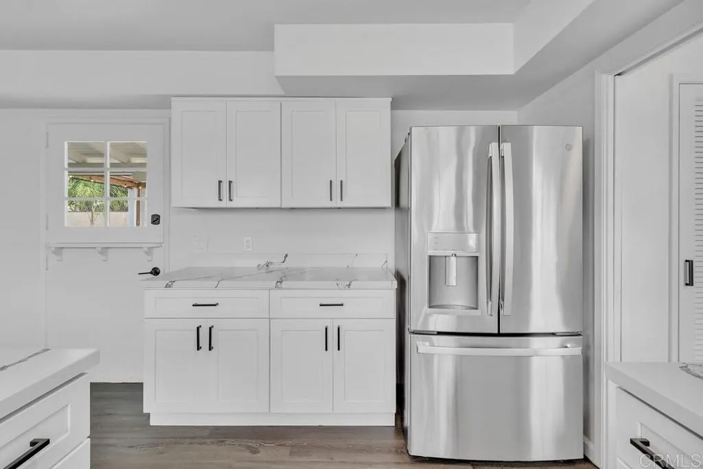 988 Pepper Drive El Cajon, CA 92021 - Photo 27 of 41 a kitchen with appliances cabinets and a counter top space