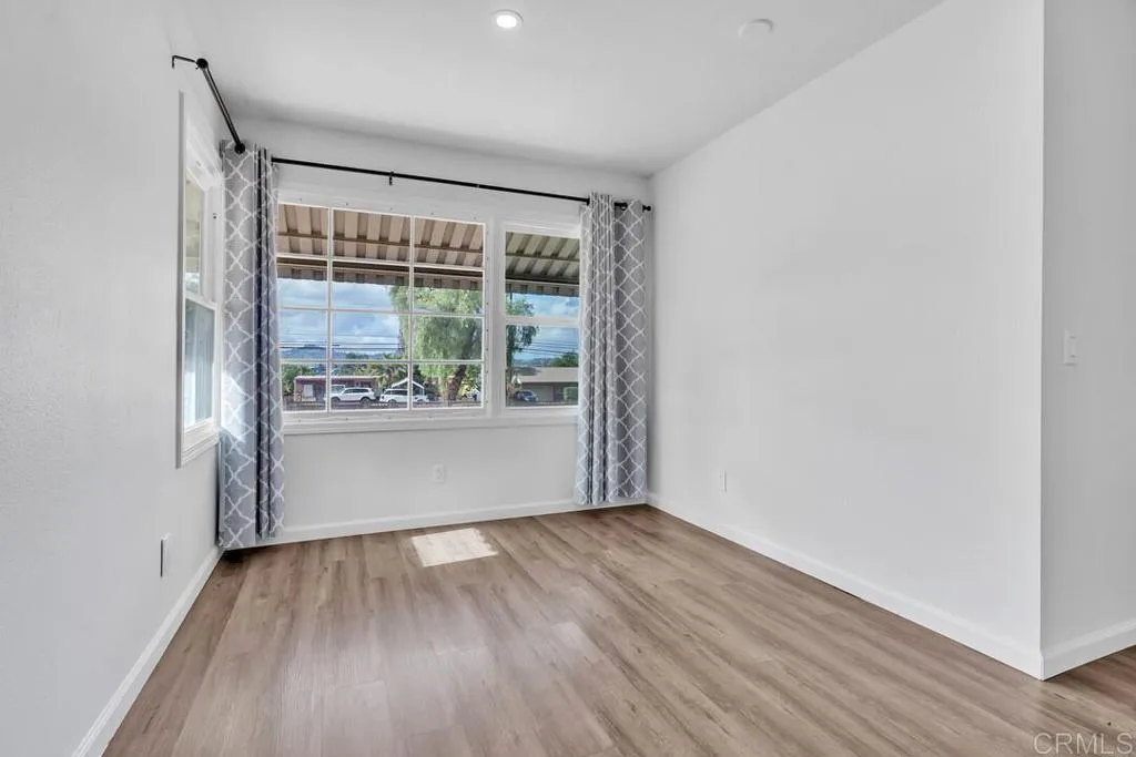 988 Pepper Drive El Cajon, CA 92021 - Photo 30 of 41 wooden floor in an empty room with a window