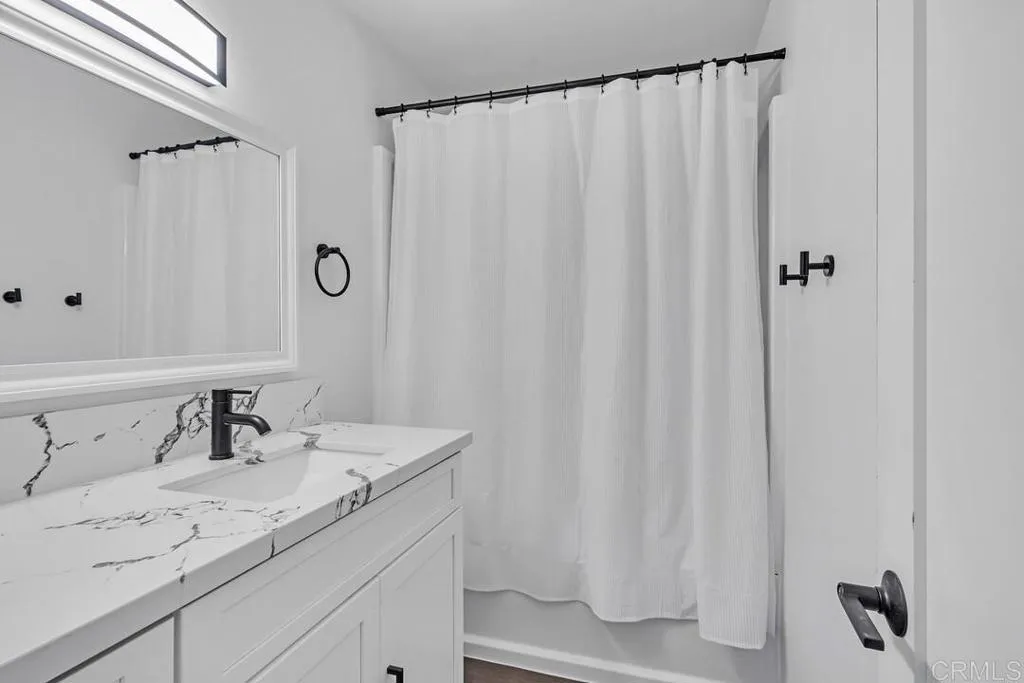 988 Pepper Drive El Cajon, CA 92021 - Photo 32 of 41 a bathroom with a sink and a mirror
