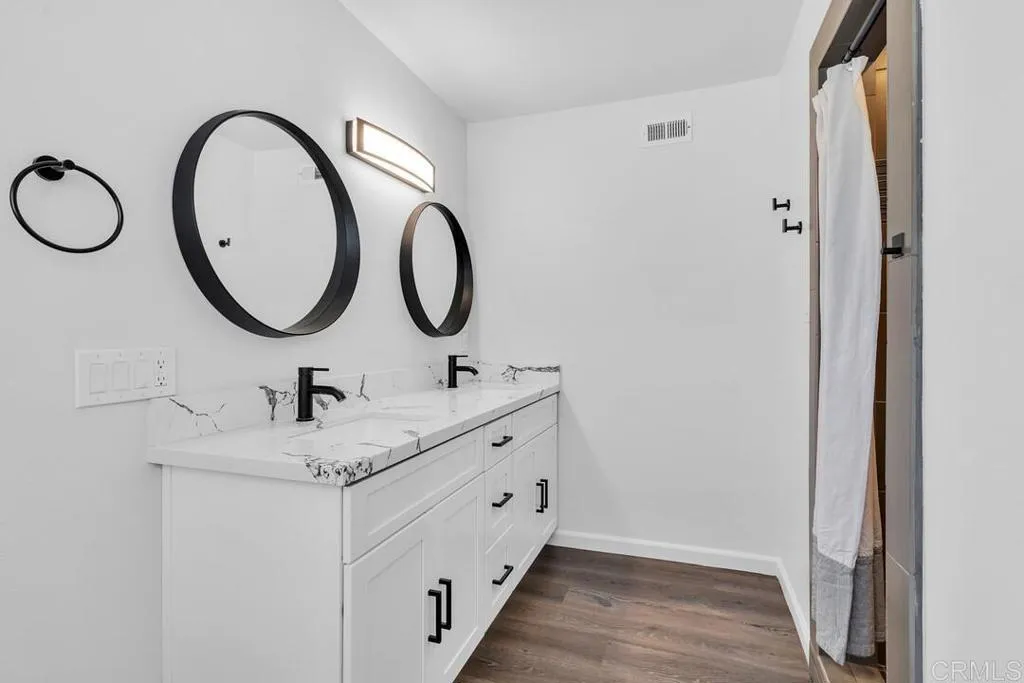 988 Pepper Drive El Cajon, CA 92021 - Photo 40 of 41 a bathroom with a granite countertop sink and a mirror