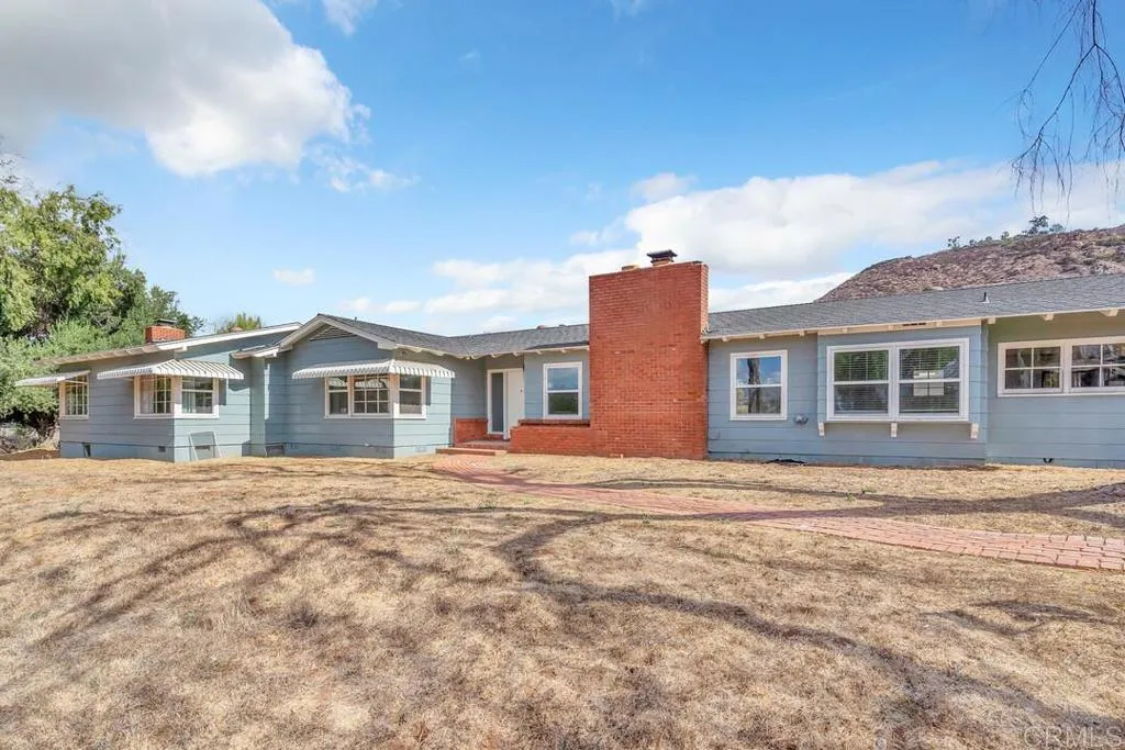 988 Pepper Drive El Cajon, CA 92021 - Photo 4 of 41 a front view of a house with a garden