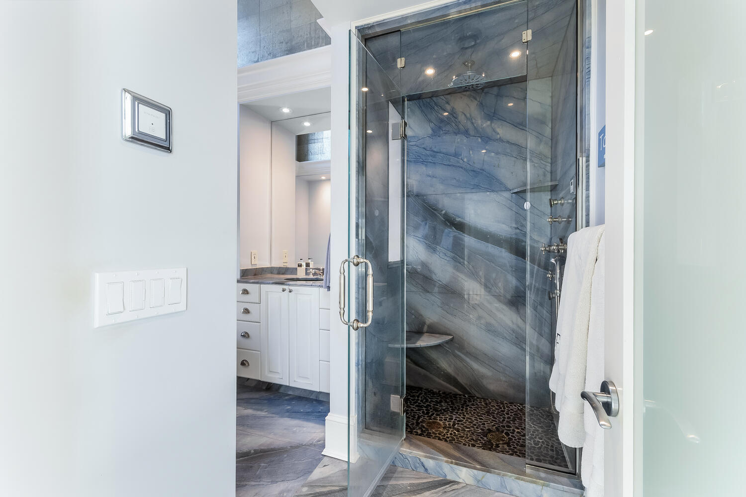 5 Plymouth Road Darien, CT 06820 - Photo 23 of 31 a bathroom with a glass shower door