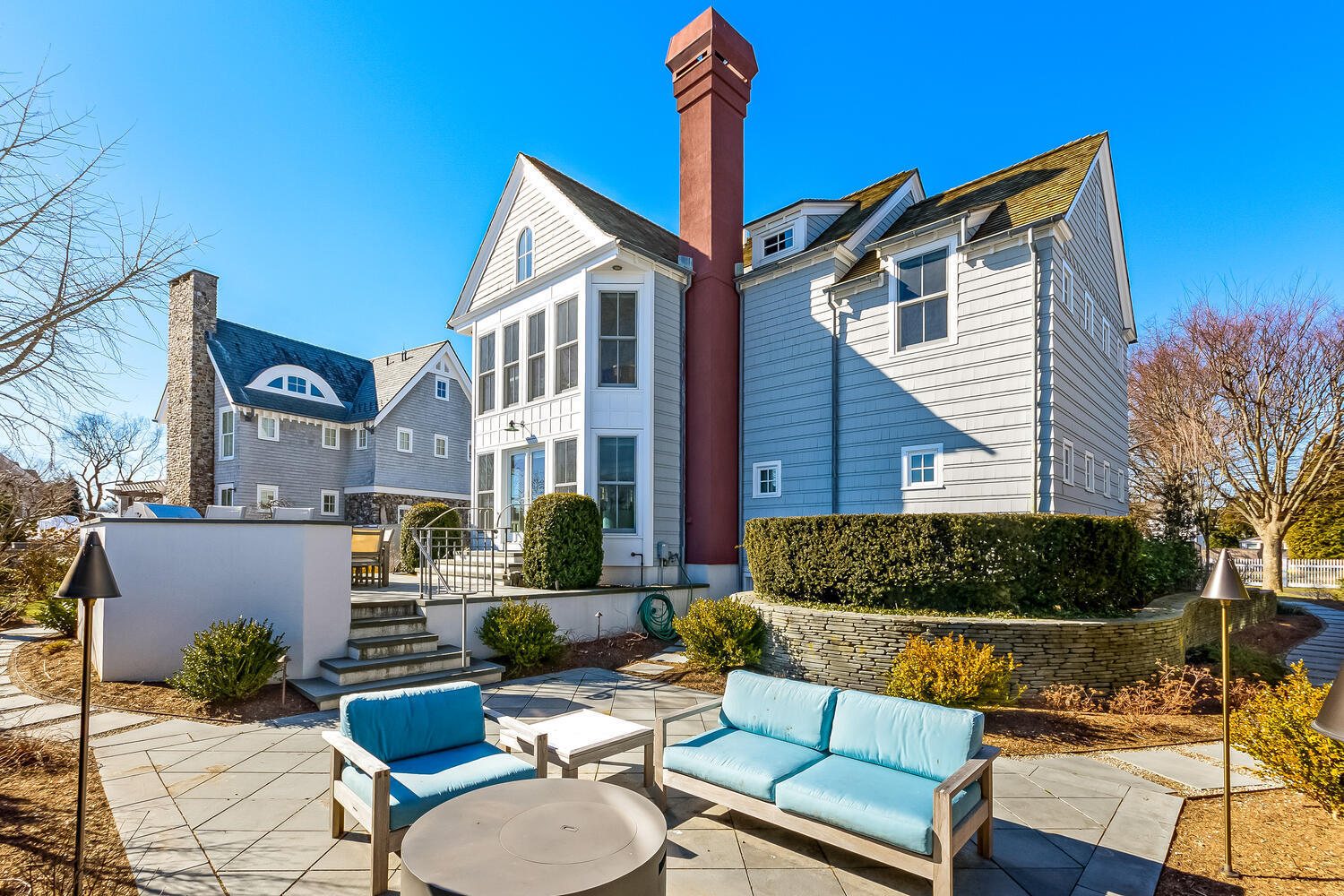 5 Plymouth Road Darien, CT 06820 - Photo 29 of 31 a view of a house with couches chairs and a fire pit