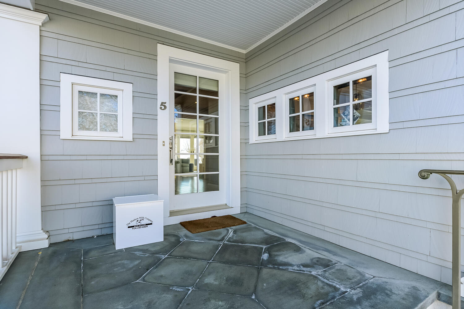 5 Plymouth Road Darien, CT 06820 - Photo 3 of 31 a view of a house with a chair and wooden door
