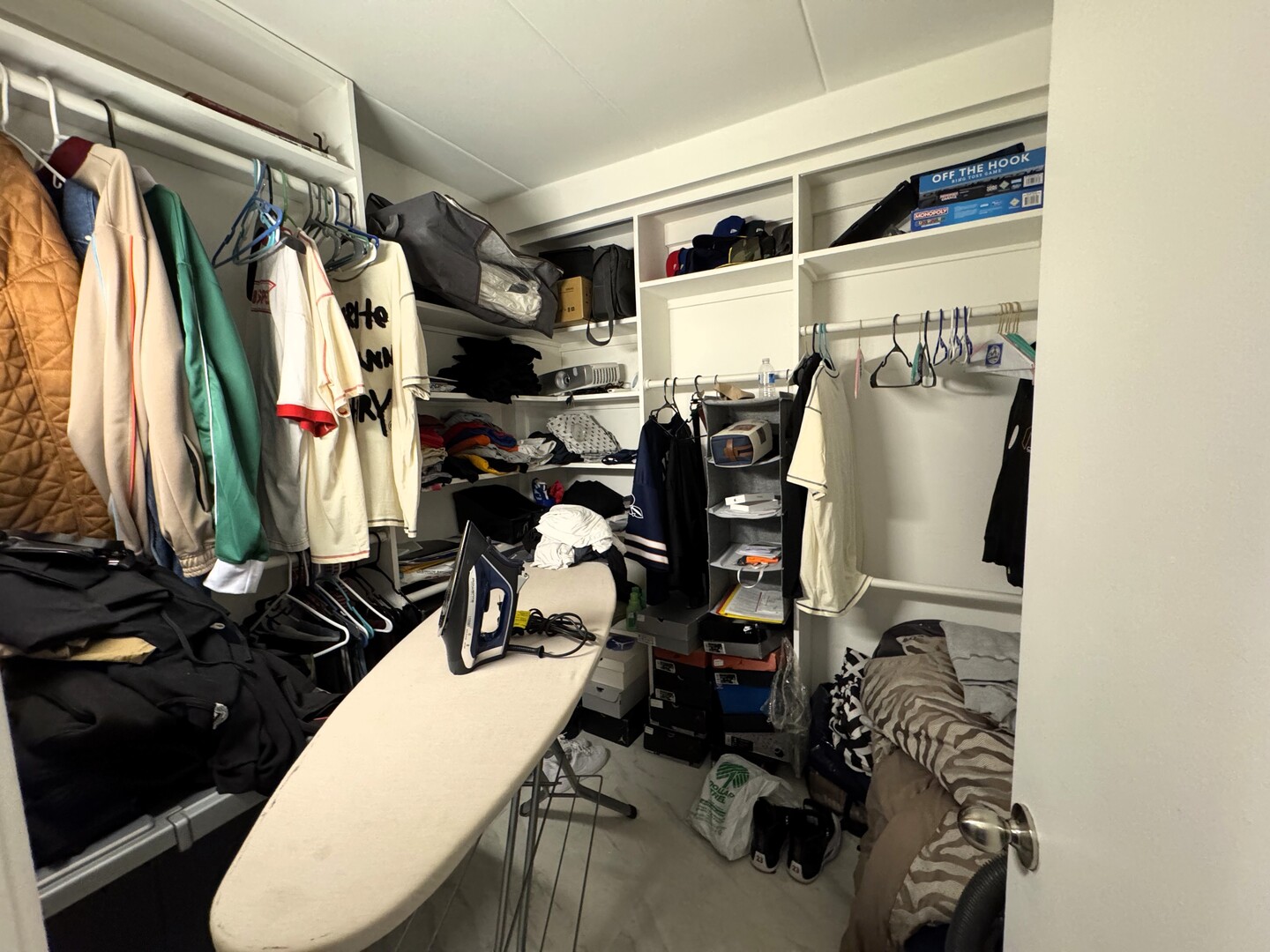 10840 Kilpatrick Avenue, Unit 1NW Oak Lawn, IL 60453 - Photo 7 of 11 a view of walk in closet with clothes and shoes