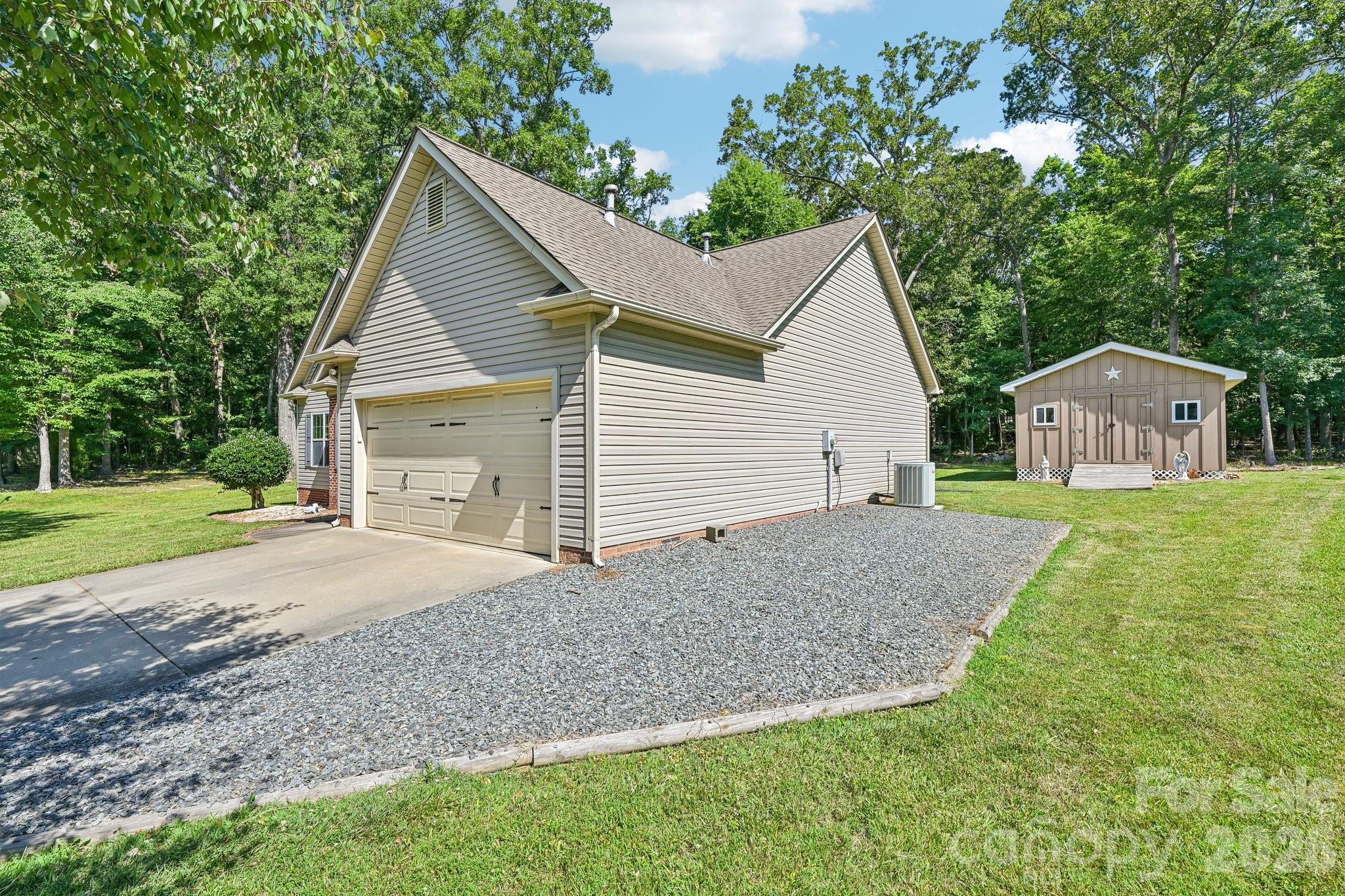 624 Hunley Street Monroe, NC 28112 - Photo 4 of 36 a view of an house with backyard space and garden