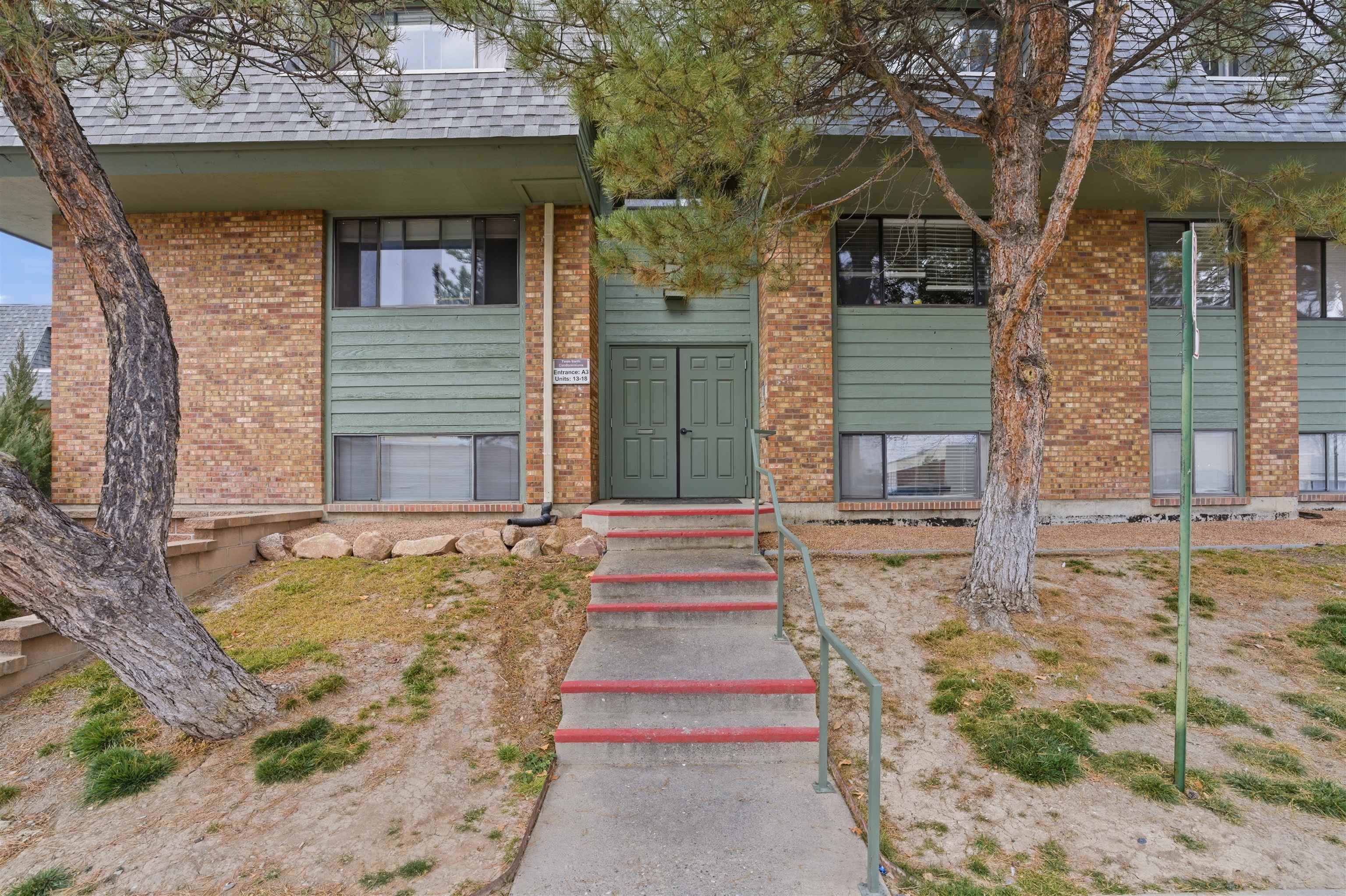 1140 Walnut Avenue, Unit 17 Grand Junction, CO 81501 - Photo 14 of 15 a front view of a house with a yard