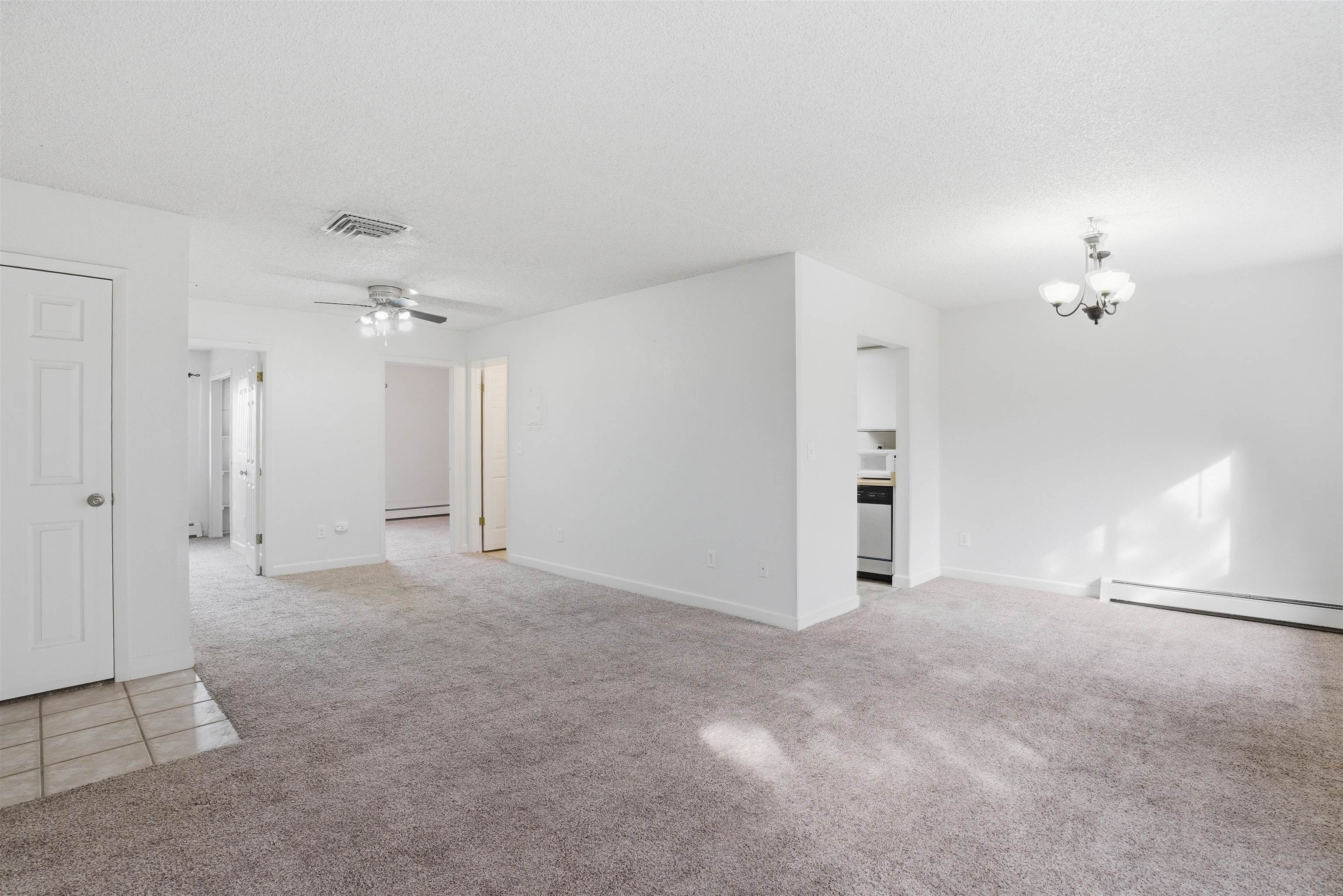 1140 Walnut Avenue, Unit 17 Grand Junction, CO 81501 - Photo 3 of 15 a view of an empty room with a ceiling fan