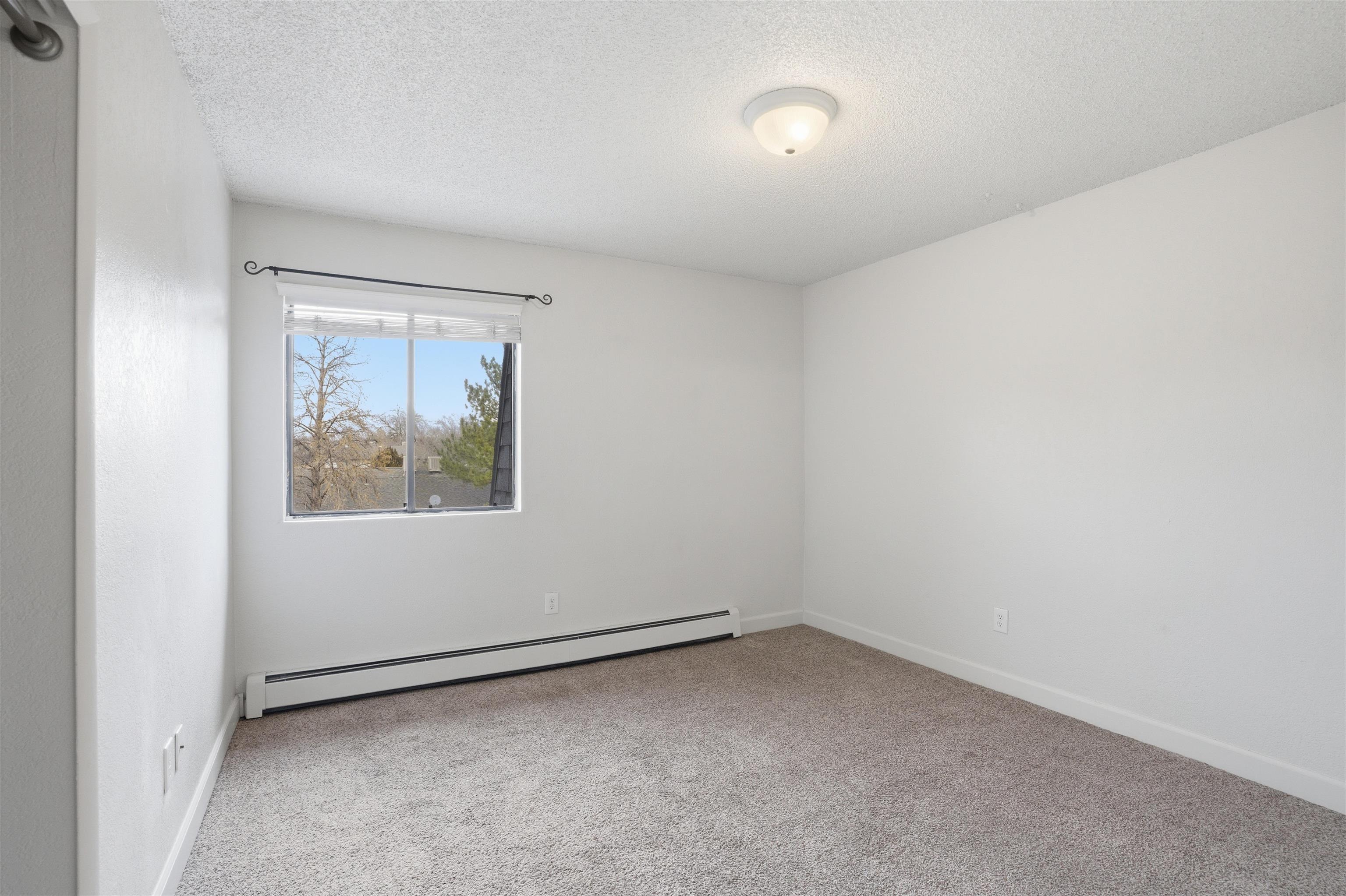 1140 Walnut Avenue, Unit 17 Grand Junction, CO 81501 - Photo 7 of 15 an empty room with a window