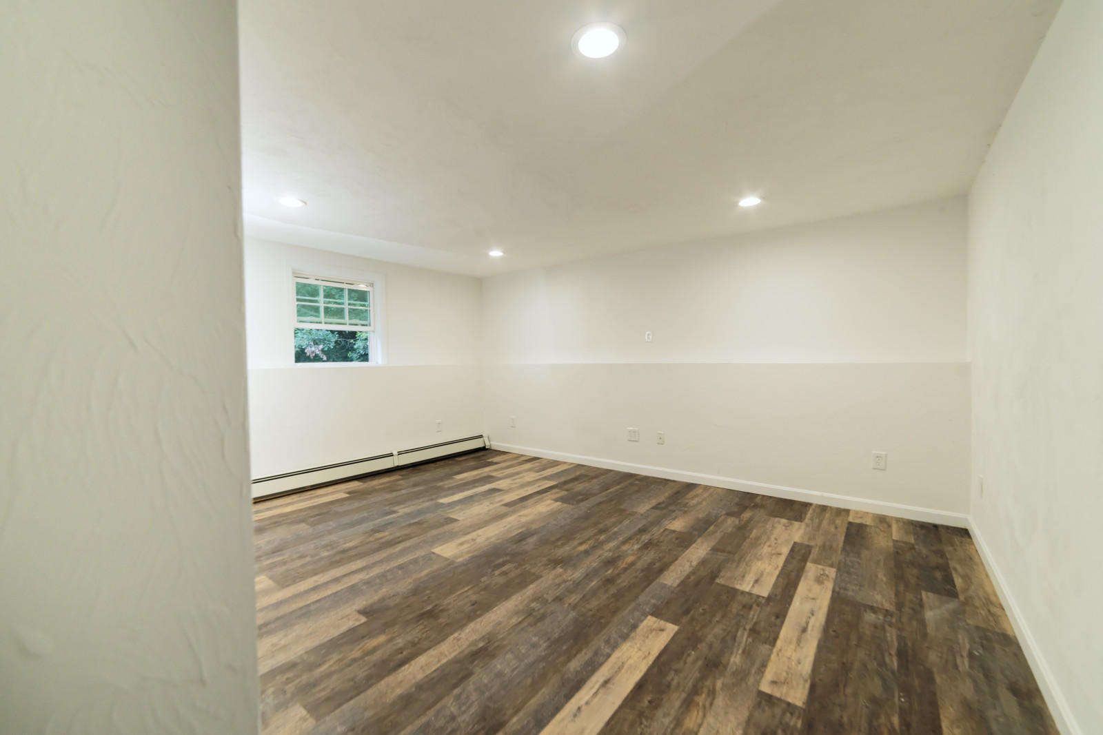 25 Fillmore Road West Yarmouth, MA 02673 - Photo 19 of 23 an empty room with wooden floor and windows