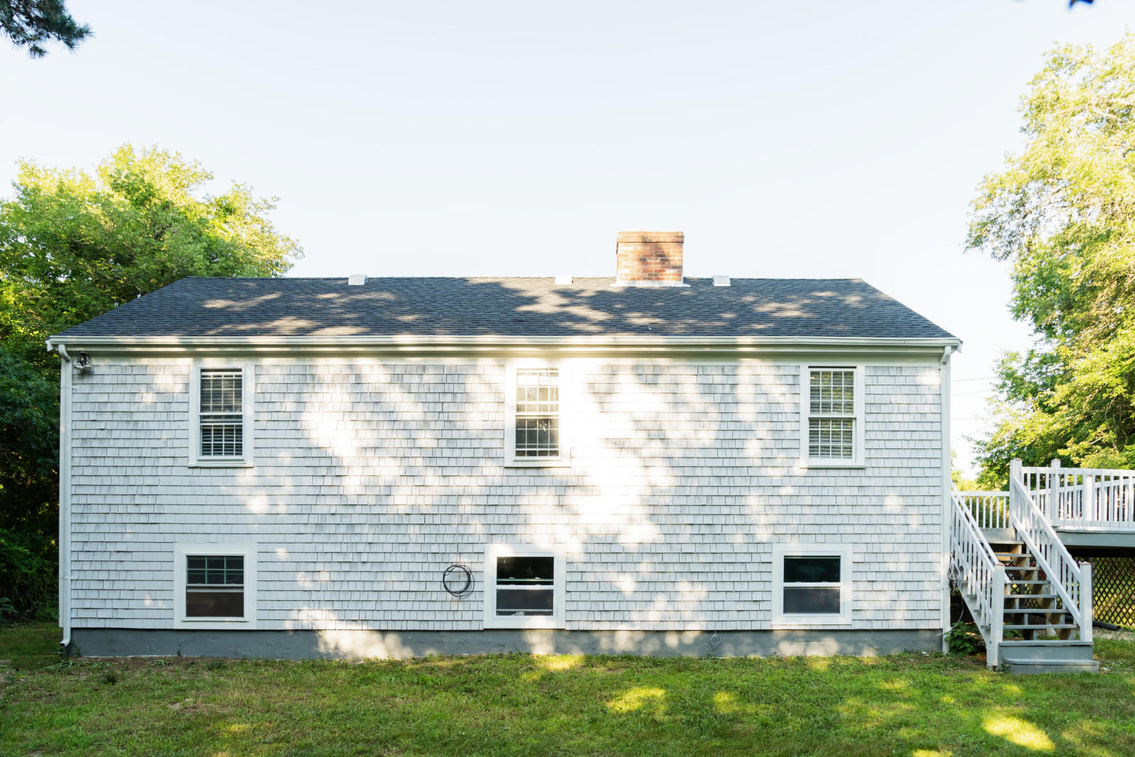 25 Fillmore Road West Yarmouth, MA 02673 - Photo 21 of 23 a view of a house with a backyard