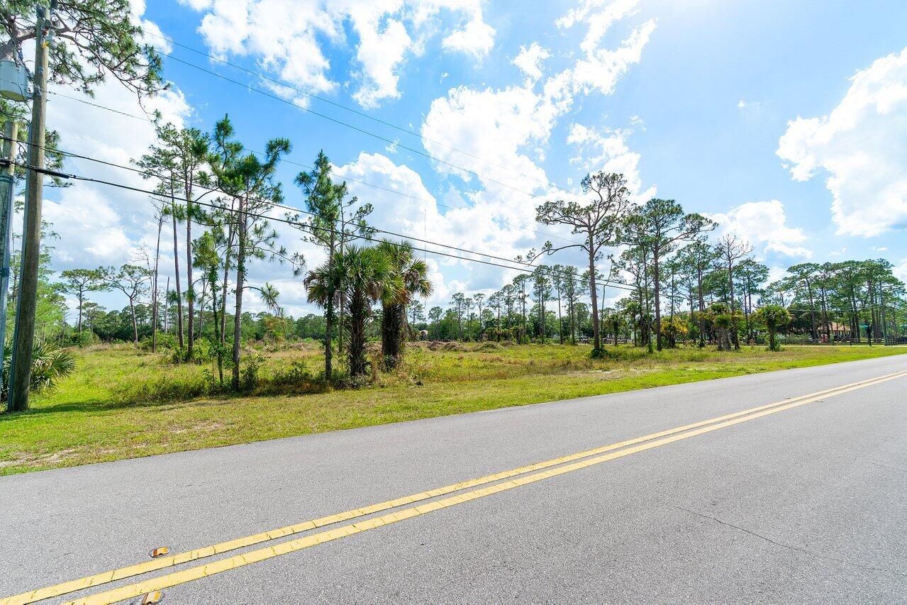 6248 Homeland Road Lake Worth, FL 33449 - Photo 8 of 22 a view of an outdoor space and a yard