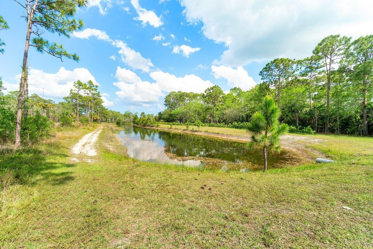 6248 Homeland Road Lake Worth, FL 33449 - Photo 10 of 22 a view of a lake with a yard