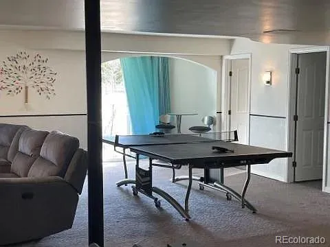 a view of a livingroom with furniture and window